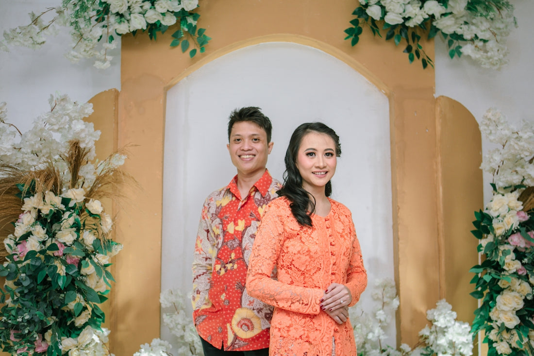 A smiling couple poses for a formal occasion.
